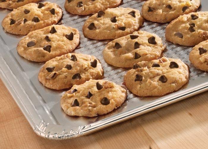 A batch of cookie son a aluminum foil cookie sheet